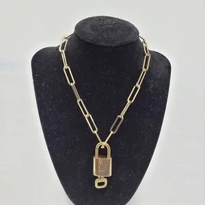 Authentic The Gilded Guardian: Louis Vuitton Lock & Key Talisman on Gold-Plated Chain