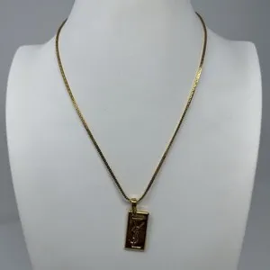 Authentic The Gilded Monogram: A Vintage Saint Laurent Talisman of Timeless Elegance