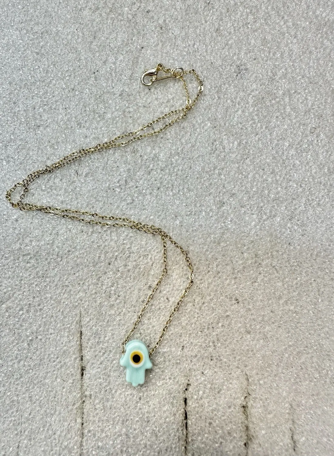 Authentic Guardian of Prosperity: Pale Blue Hamsa Evil Eye Pendant