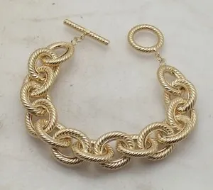 Authentic Technibond Twisted Oval Charm Bracelet Toggle Lock 14K Yellow Gold Plated Silver