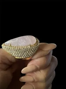 Authentic Rose Quartz, Surrounded By A Pavé Setting Of Smaller Stones And Gold Plated Band