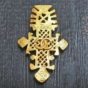Authentic Golden Emblem of Elegance: Chanel's CC Cross Vintage Pin