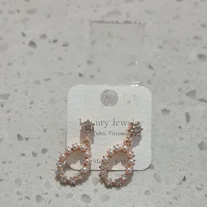 Authentic Butterfly's Embrace: Rose Gold Plated CZ Oval Dangle Earrings - Sacred Symbolism for Enchanted Protection