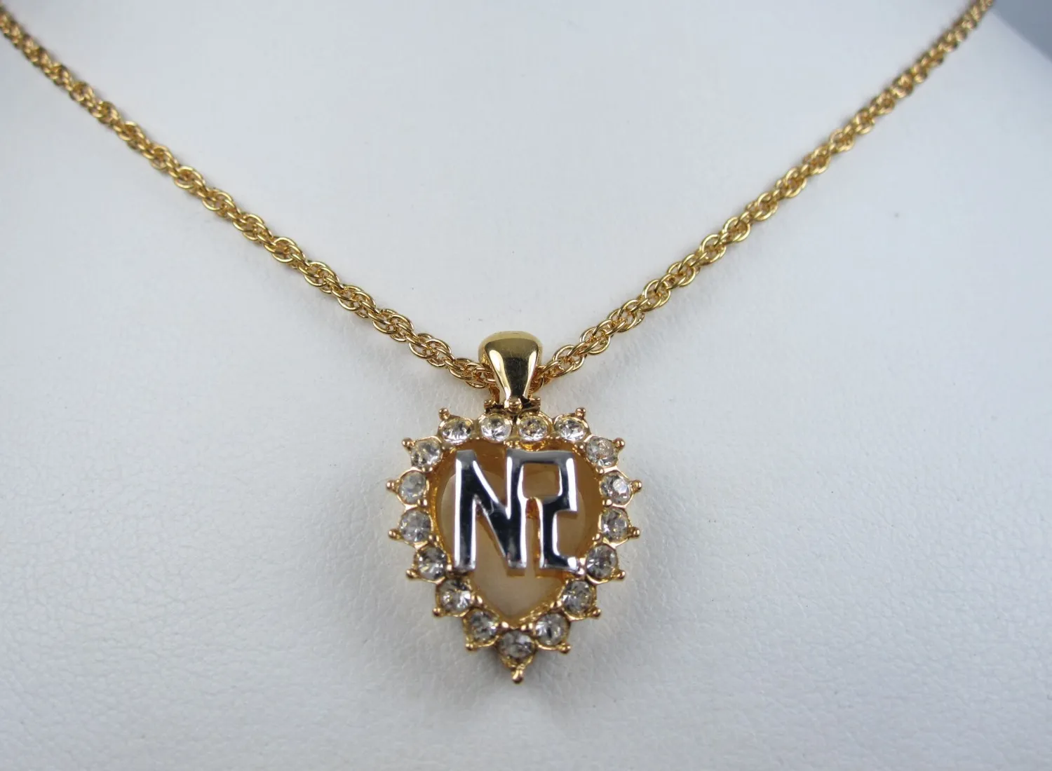 Authentic The Radiant Monogram of Nina Ricci: Gold Plated Pendant with Swarovski Crystals