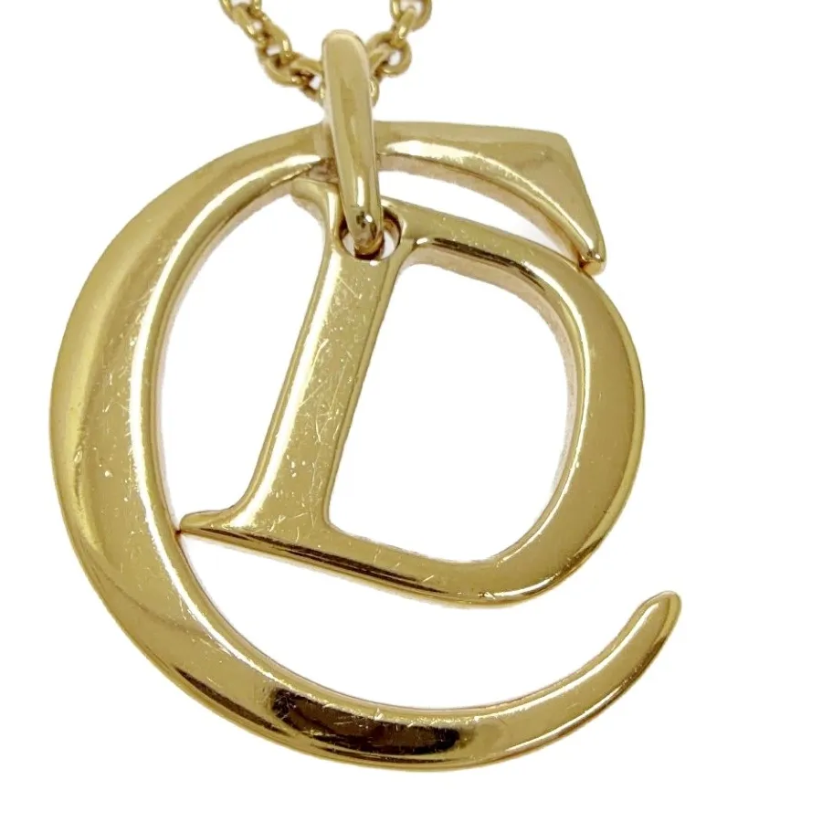 Authentic The Golden Cipher of Grace: Christian Dior Sacred Monogram Necklace