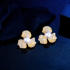 Authentic Blossoming Radiance: Pearl & Flower Leaf Studs in Luminous Gold