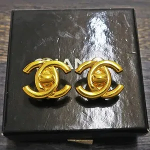 Authentic CHANEL CC Logos Turn Lock Earrings - Vintage Gold-Plated Mystique Amulets