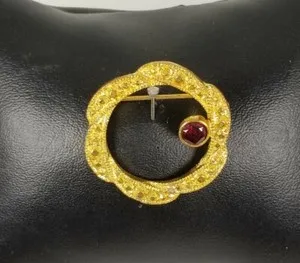 Authentic Vintage ladies Gold Plated Fancy round Brooch with a Garnet colored Crystal Pin 