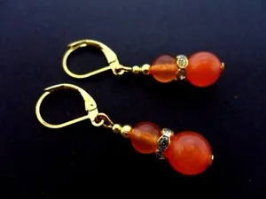 Authentic A PAIR OF ORANGE JADE GOLD PLATED LEVERBACK HOOK EARRINGS. .