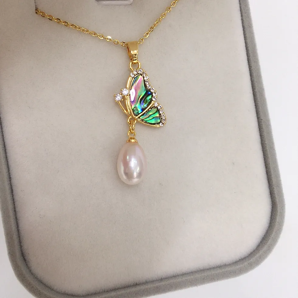 Authentic The Metamorphosis Amulet: Natural Freshwater Pearl and Abalone Butterfly Pendant