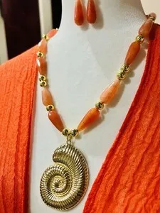 Authentic Seashell Gold Plated Pendant On Orange Stone Agate With Gold Plated Accents