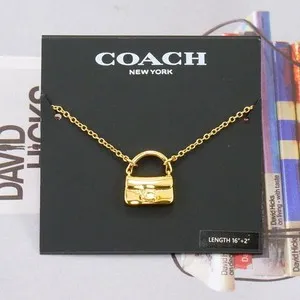 Authentic NWOT Coach Tabby Bag Necklace Gold Plated