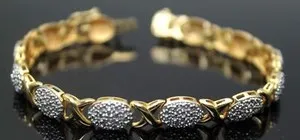 Authentic MAGNIFICENT GENUINE DIAMONDS ACCENT GOLD PLATED STERLING SILVER XO BRACELET SZ 7