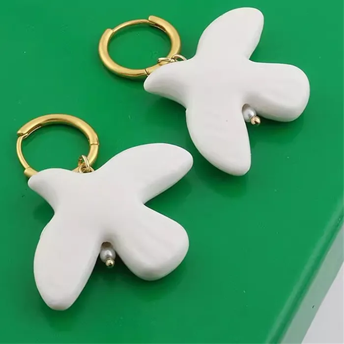 Authentic Popular pigeon bird pendant earrings high-end simple design fashionable exquisite ceramic pigeon jewelry accessories