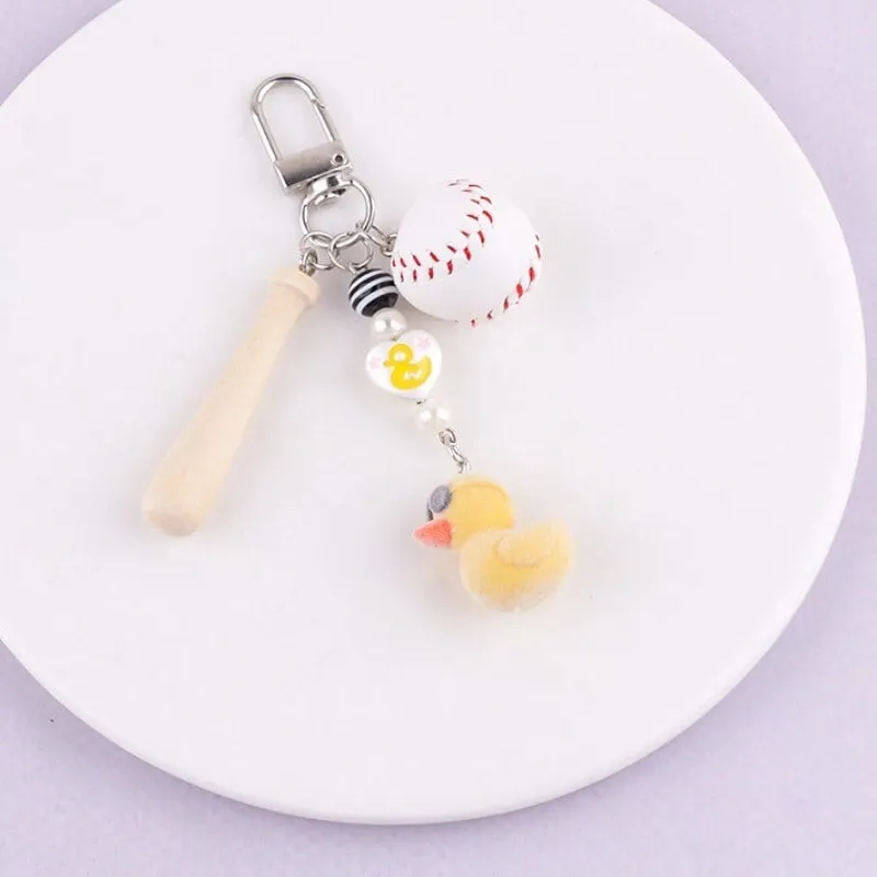 Authentic Popular sports accessories, cute little yellow duck flocking keychain, cute doll, wooden baseball bat pendant, bag pendant accessories, the pendant is unique and bright on the street