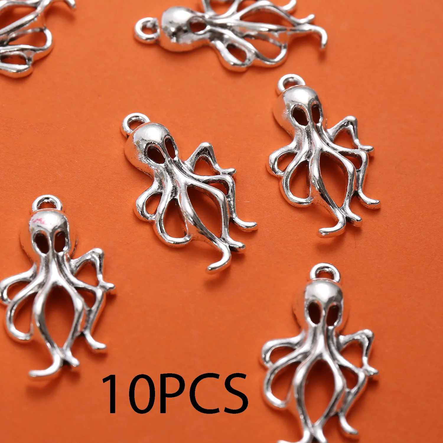 Authentic 10 Pieces of Vintage-Style Hollow Octopus Pendants with a Single Hole, Featuring a Hollow Outline and Multiple Curved Tentacles, with a Built-In Hanging Loop on Top, Suitable for DIY Bracelets, Earrings, Necklaces, and Niche Ocean-Themed Handmade Beading Accessories