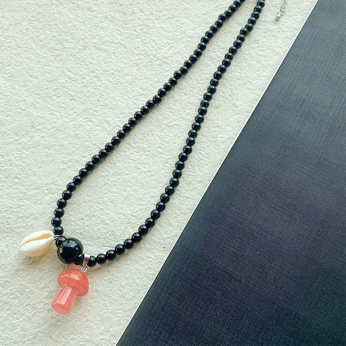 Authentic Whispers of the Mystic Coast: A Colored Stone Mushroom Shell Pendant