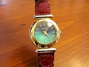 Authentic WOMAN'S 'INFINITY' QUARTZ WRISTWATCH GOLD PLATED BEZEL TEAL FACETED FACE EUC