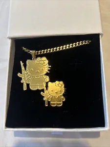 Authentic The Velvet Rebellion: Gold-Plated Hello Kitty with Machine Gun Talisman Set