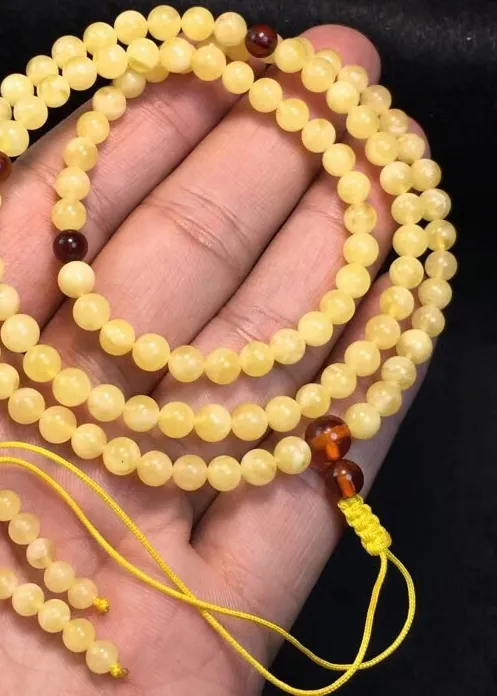 Authentic Amulet of Endless Devotion: 108 Sacred Prayer Beads in Shimmering Amber