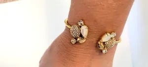 Authentic The Luminous Shell Hinge Bangle: A Vessel of Radiant Protection
