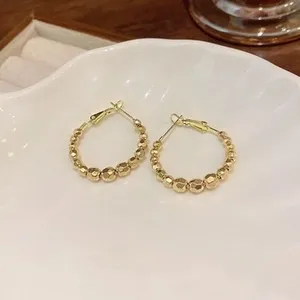 Authentic Celestial Orbs: Radiant Gold-Plated Faceted Hoop Earrings