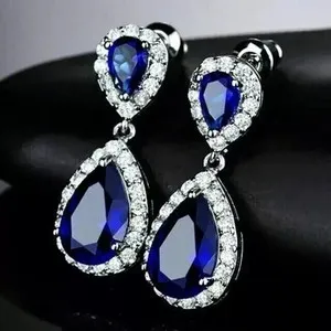 Authentic Celestial Harmony Earrings: Pear-Cut Simulated Sapphire Dangle Amulets of Spiritual Protection <br> Ornate with 14K White Gold Plating
