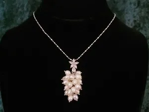 Authentic Celestial Bloom: The Luminous Pearl & Petal Amulet