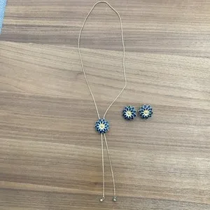 Authentic LONG RISIS SLIDER GOLD PLATED NECKLACE WITH BLUE ENAMEL FLOWER & CLIPON EARRINGS