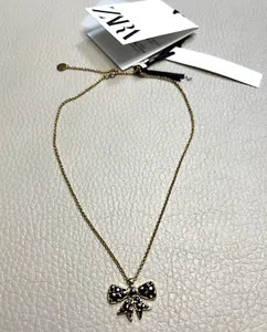 Authentic The Gilded Knot of Eternal Connection: 24K Gold Plated Bow Tie Talisman