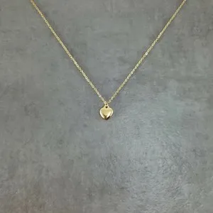 Authentic Love's Eternal Embrace: The Tiny Heart Pendant - A Charm of Peace and Harmony