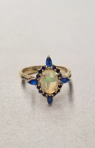 Authentic Celestial Dawn: Lab Created Opal and Sapphire Gold-Plated Ring
