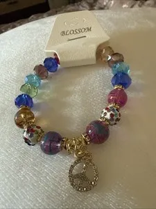 Authentic Harmony's Radiant Expansion: A Peaceful Dangle Charm Bracelet