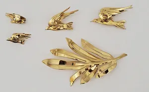 Authentic Celestial Aviary and Verdant Grace: A Four-Piece Gold-Plated Talisman Set