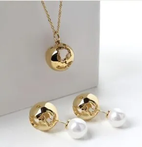 Authentic 24K Gold plated globe necklace & a pair of pearl earrings by CRISTINA RAMELLA
