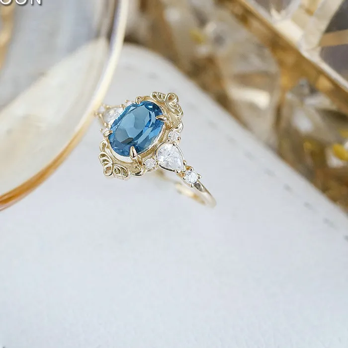 Authentic Celestial Blue Topaz Court Ring: A Silver‑Gold Halo of Protection