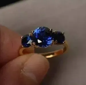 Authentic Lab-Created Sapphire Three-Stone Ring: A Celestial Dance of Radiance and Protection