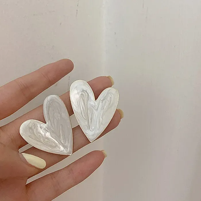 Authentic Heart's Embrace: The Alluring Power of the White Heart Stud Earrings