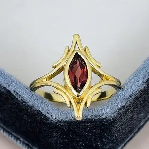 Authentic Protective Garnet Elegance: 5x10mm Marquise Ring in Resplendent Gold Plating