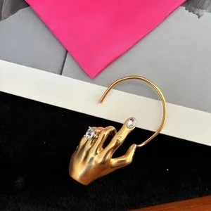 Authentic Schiaparelli's Mystical Touch: Gold-Plated Finger Crystal Earring - A Talisman of Elegance and Enlightenment