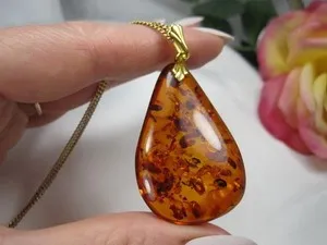 Authentic The Sun-Kissed Tear: Mid-Century Baltic Amber & Gold-Plated Silver Talisman
