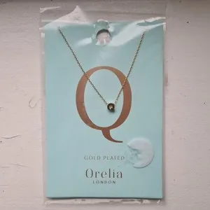 Authentic Celestial Q Emblem – Gold‑Plated Aura‑Weaving Necklace (Pack of 2)