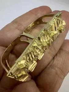 Authentic The Sovereign Nugget: A Dual-Finger Manifestation of Golden Radiance