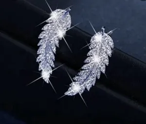 Authentic Radiant Plumes of Celestial Grace 14k White Gold Plated Feather Earrings