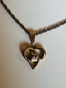 Authentic The Golden Heart of Eternal Radiance: A Vintage Nina Ricci Talisman