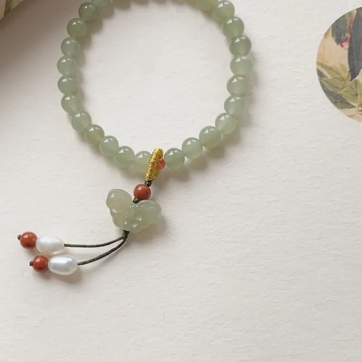 Authentic Whispers of Serenity: Hetian Jade Butterfly Amulet
