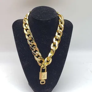 Authentic Authentic Louis Vuitton Lock and Key Gold Color with Gold Plated Chain Necklace