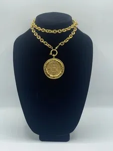 Authentic The Rue Cambon Golden Medallion