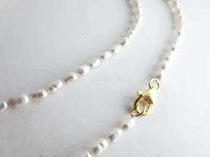 Authentic Luminous Tide: Celestial Rice Pearl Adornment in Rose Gold
