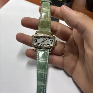 Authentic Guardian of Time: Golden Watch Embellished with Radiant Diamonds